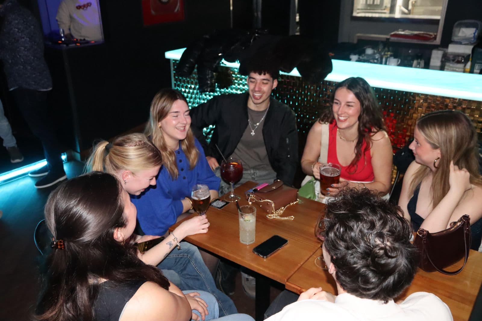 A group of guests gathered around a table at a Barcelona International Social event